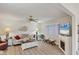 Bright living room with modern flooring, fireplace, and comfortable seating at 3941 Glen Oaks E Dr # 32, Sarasota, FL 34232