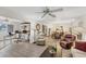 Expansive living area with a view into a dining space and home office at 3941 Glen Oaks E Dr # 32, Sarasota, FL 34232