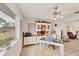 Bright office with large window, built-in storage, a desk and a comfortable chair at 3941 Glen Oaks E Dr # 32, Sarasota, FL 34232