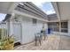 Cozy outdoor patio featuring a quaint seating area and charming decor at 3941 Glen Oaks E Dr # 32, Sarasota, FL 34232