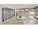 Cozy sunroom with wicker furniture and large sliding glass windows for natural light at 3941 Glen Oaks E Dr # 32, Sarasota, FL 34232