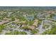 Aerial view of the neighborhood, highlighting landscaping, water features, and community layout at 4009 Crockers Lake Blvd # 22, Sarasota, FL 34238