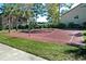 Outdoor basketball court for residents' recreational use, surrounded by trees at 4009 Crockers Lake Blvd # 22, Sarasota, FL 34238