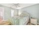 Bright bedroom showing ensuite entrance and ceiling fan at 4009 Crockers Lake Blvd # 22, Sarasota, FL 34238