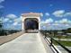 Inviting pedestrian bridge on The Legacy Trail with covered walkway at 4009 Crockers Lake Blvd # 22, Sarasota, FL 34238