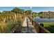 Picturesque wooden dock extends into a calm lake at 4009 Crockers Lake Blvd # 22, Sarasota, FL 34238