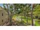 This manicured lawn area shows shuffleboard courts and lots of mature shade trees at 4009 Crockers Lake Blvd # 22, Sarasota, FL 34238