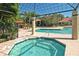 View of the hot tub and pool area shows plenty of seating at 4009 Crockers Lake Blvd # 22, Sarasota, FL 34238