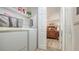 Open laundry room with direct access to the primary bedroom at 4009 Crockers Lake Blvd # 22, Sarasota, FL 34238