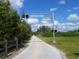 Scenic view of The Legacy Trail with lush greenery and a clear blue sky at 4009 Crockers Lake Blvd # 22, Sarasota, FL 34238