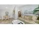 Cozy living room with a couch, accent chairs, views of the kitchen and dining area at 4009 Crockers Lake Blvd # 22, Sarasota, FL 34238