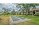 Well maintained shuffleboard courts sit on a grassy lawn in this community at 4009 Crockers Lake Blvd # 22, Sarasota, FL 34238
