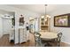 Dining area features a white table with seating for four at 4015 Lake Bayshore Dr # 108, Bradenton, FL 34205