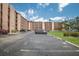 Condo complex with assigned parking spots and green space at 4015 Lake Bayshore Dr # 108, Bradenton, FL 34205