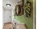 Hallway featuring painted dresser with wall decor on green wall at 4015 Lake Bayshore Dr # 108, Bradenton, FL 34205