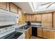 Well-lit kitchen with skylight and stainless steel sink at 4015 Lake Bayshore Dr # 108, Bradenton, FL 34205