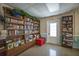 Charming library space with ample shelving for books, creating a cozy reading environment at 4015 Lake Bayshore Dr # 108, Bradenton, FL 34205