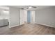 The main bedroom features wood floors and a view into the bathroom and closet at 4233 Abaco Ct, New Port Richey, FL 34653