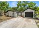 Features a clean white facade, dark-colored garage door, and low-maintenance landscaping at 4233 Abaco Ct, New Port Richey, FL 34653
