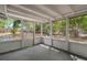 A cozy enclosed patio with lots of natural light and a view of the backyard at 4233 Abaco Ct, New Port Richey, FL 34653