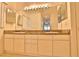 Bathroom featuring a dual sink vanity with ample storage and modern fixtures at 4264 Central Sarasota Pkwy # 116, Sarasota, FL 34238