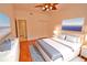 Comfortable bedroom featuring a bed with stylish blue and white bedding, and wood flooring at 4264 Central Sarasota Pkwy # 116, Sarasota, FL 34238