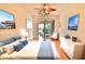 Well-lit bedroom with access to the screened-in patio, complemented by wood flooring at 4264 Central Sarasota Pkwy # 116, Sarasota, FL 34238