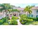 Elegant two-story building with lush tropical landscaping and private balconies at 4264 Central Sarasota Pkwy # 116, Sarasota, FL 34238