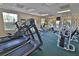 Spacious gym featuring multiple treadmills, elliptical machines, and weight training equipment at 4264 Central Sarasota Pkwy # 116, Sarasota, FL 34238