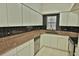 The kitchen is equipped with stainless steel appliances and ample counter space at 4264 Central Sarasota Pkwy # 116, Sarasota, FL 34238