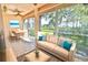 A cozy living area with a dining table near a window, allowing natural light and serene outdoor views at 4264 Central Sarasota Pkwy # 116, Sarasota, FL 34238