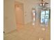 Spacious living area with tile flooring, lots of natural light, and open floor plan at 4264 Central Sarasota Pkwy # 116, Sarasota, FL 34238