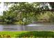 Scenic water view featuring fountain and lush green surroundings at 4264 Central Sarasota Pkwy # 116, Sarasota, FL 34238