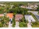 Overhead shot of property showing the home's layout, mature landscaping, and nearby homes at 4435 Beauchamp Ct, Sarasota, FL 34243