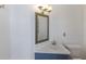 Simple half-bath with modern vanity, mirror, and fixtures at 4435 Beauchamp Ct, Sarasota, FL 34243