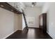 Bedroom with a built in loft, ladder, dark hardwood floors and shuttered window at 4435 Beauchamp Ct, Sarasota, FL 34243