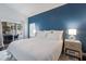 Charming bedroom boasting a bright blue wall, serene ambiance, and access to an outdoor patio at 4435 Beauchamp Ct, Sarasota, FL 34243