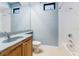Functional bathroom featuring a large mirror, light-colored walls, and combination shower-bathtub, offering everyday convenience at 4579 Tuscana Dr, Sarasota, FL 34241