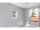 Minimalist bedroom features a modern window view and neutral carpeting, creating a calming and bright atmosphere at 4579 Tuscana Dr, Sarasota, FL 34241
