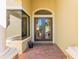Charming entryway featuring double doors with glass panels and brick-laid porch at 4579 Tuscana Dr, Sarasota, FL 34241
