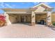 A two car garage with doors open to a paved driveway and a manicured front yard at 4579 Tuscana Dr, Sarasota, FL 34241
