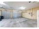 Spacious garage with two bays, light yellow walls, and ample overhead lighting at 4579 Tuscana Dr, Sarasota, FL 34241