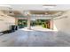A two car garage with doors open to the view of the home's lovely brick driveway and landscaping at 4579 Tuscana Dr, Sarasota, FL 34241