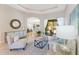 Bright living room with tile flooring, stylish furnishings, and open access to the pool area at 4579 Tuscana Dr, Sarasota, FL 34241