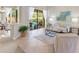 Comfortable living room with neutral decor, sliding doors to pool and patio at 4579 Tuscana Dr, Sarasota, FL 34241