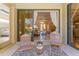 Inviting patio with comfortable seating overlooking the pool and the sun-filled open living area through sliding glass doors at 4579 Tuscana Dr, Sarasota, FL 34241