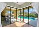 An outdoor patio and pool area with a screened-in enclosure and plenty of sunshine at 4579 Tuscana Dr, Sarasota, FL 34241