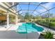 An inviting screened-in pool area featuring a sparkling pool and a relaxing spa at 4579 Tuscana Dr, Sarasota, FL 34241