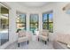 Cozy sitting area with pool view and comfortable seating at 4579 Tuscana Dr, Sarasota, FL 34241