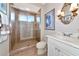 Bathroom featuring a tiled shower with glass door and vanity at 4700 Mainsail Dr, Bradenton, FL 34208